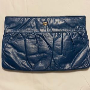 Woman’s blue leather vintage clutch